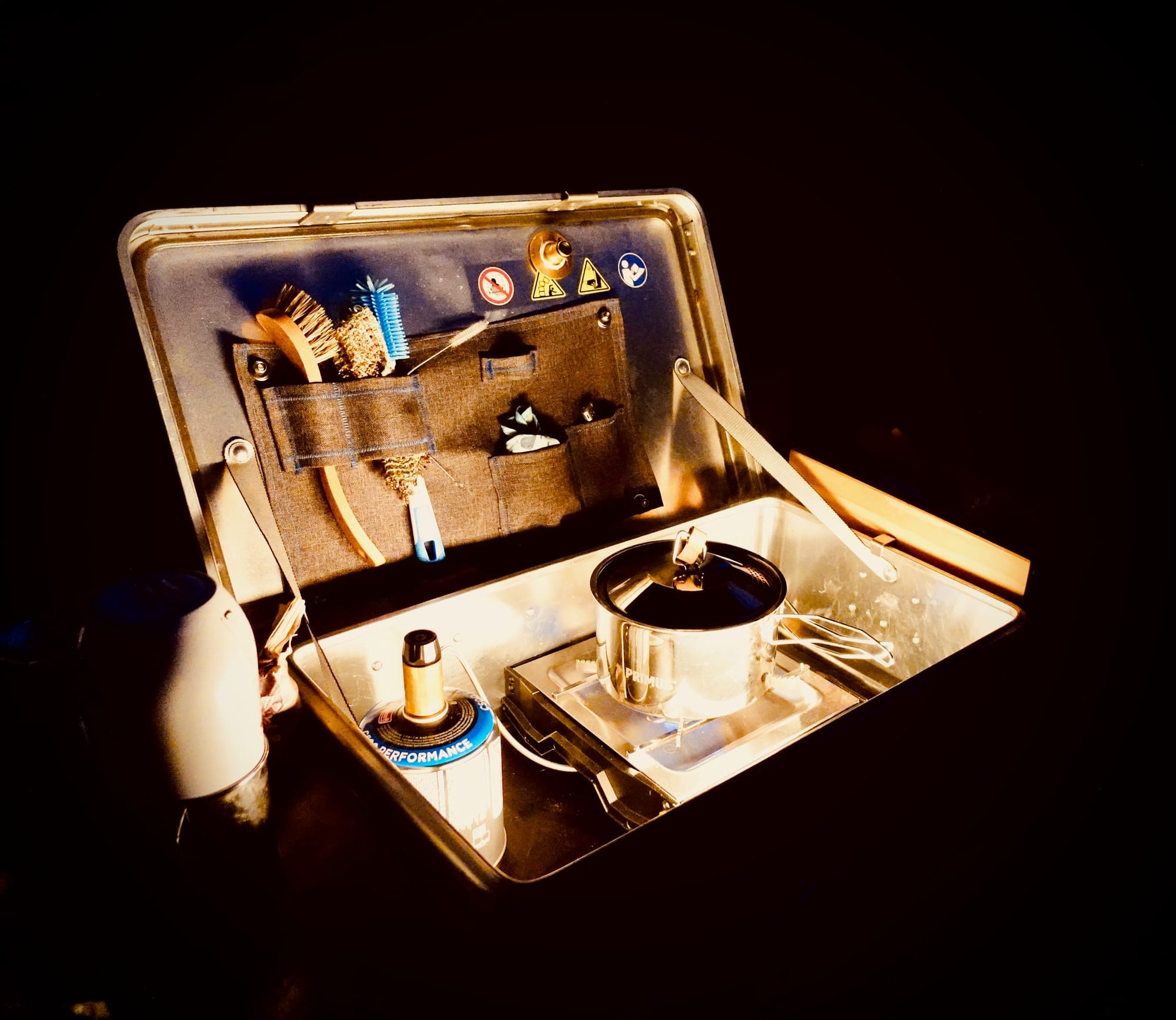 Image of a portable camping kitchen in the dark