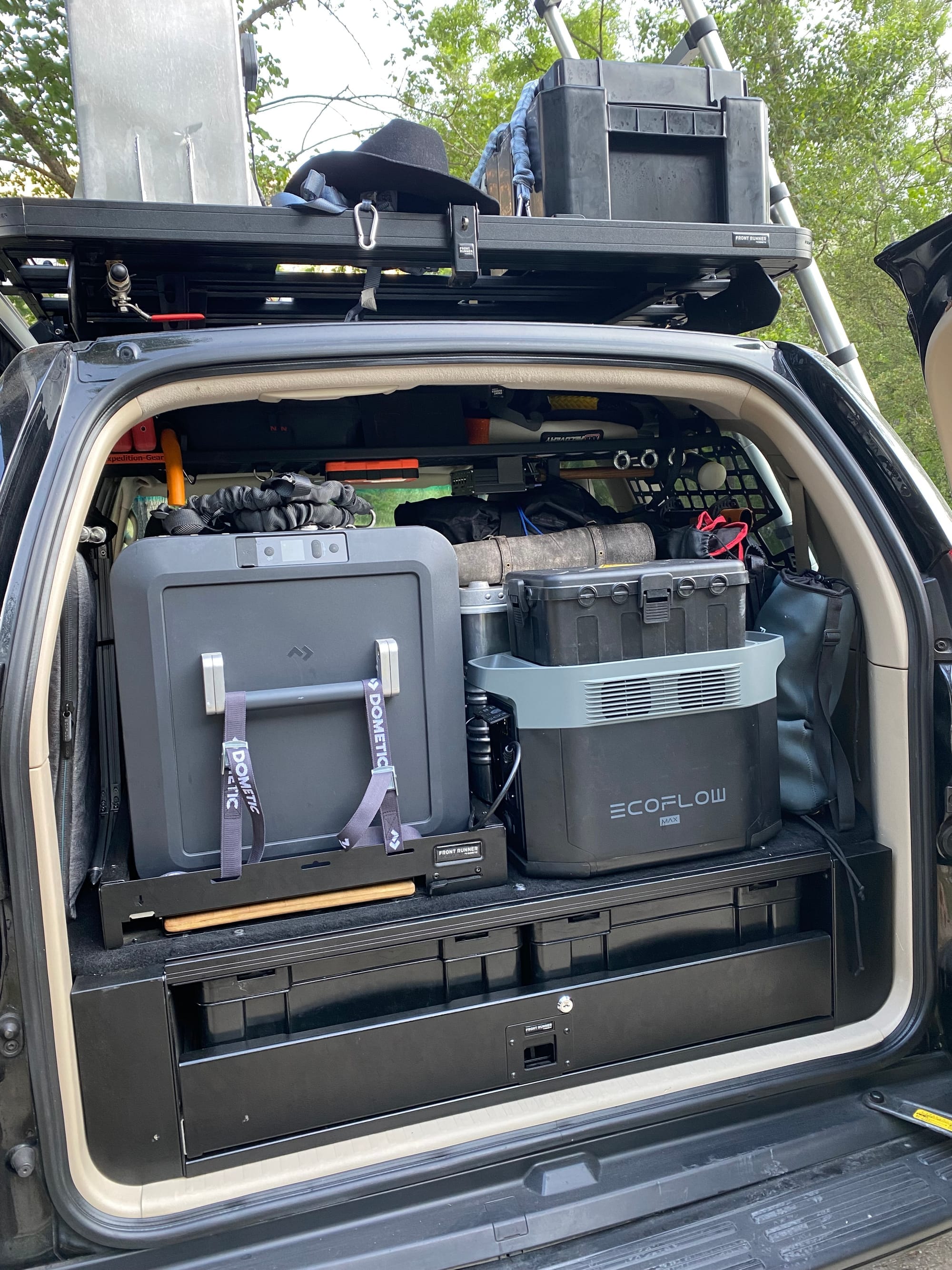 Image of the trunk of our Land Cruiser full with overlanding equipment