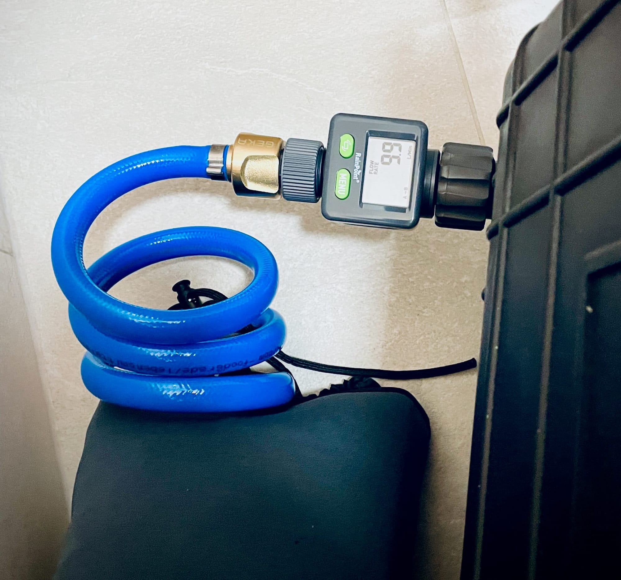 Image of a flow meter displaying the throughput through a garden hose.