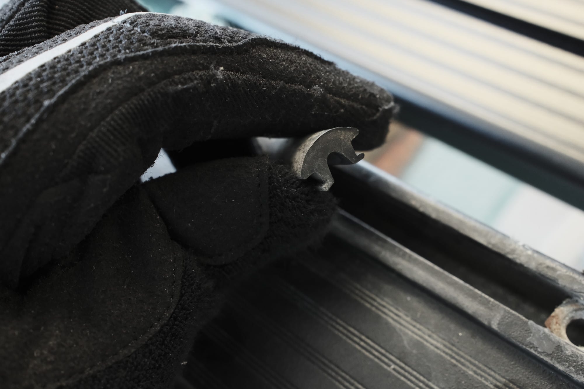 Removing a gasket from a T-slot on the roof rack