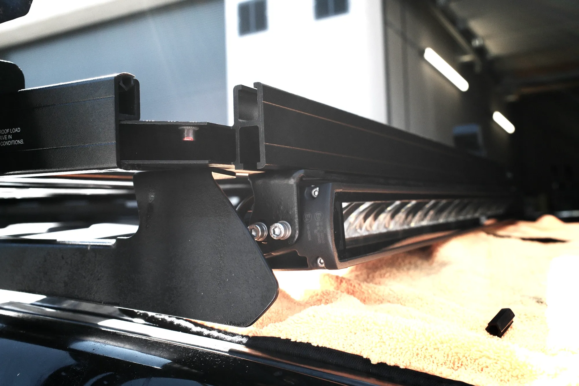 Roof rack almost fully assembled, with the front crossbar replaced
