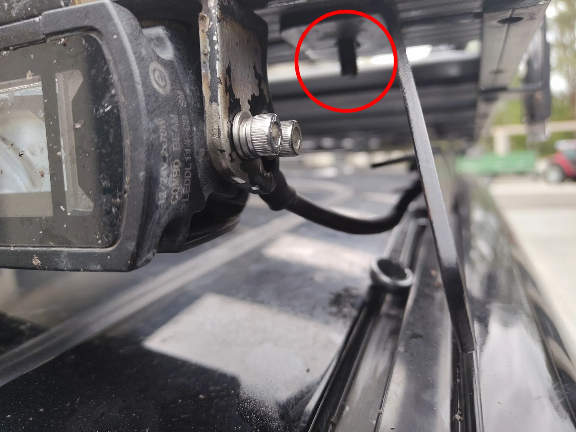 Close-up of the roof rack showing a visible screw